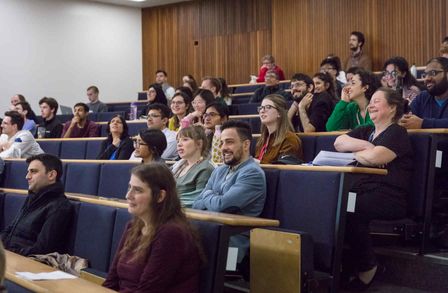 Photo of the audience laughing at entertaining comments of Magda Titirici