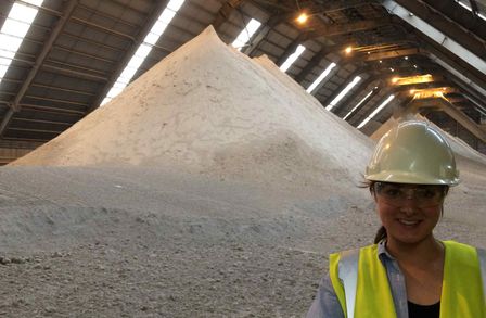 Anna Hankin photographed in front of mountains of gypsum