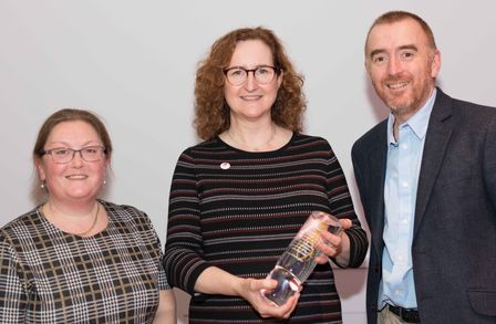 Colleagues collecting an award