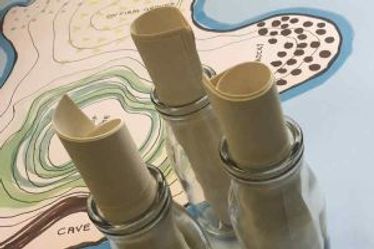 Educational game with scrolls in glass bottles on a map