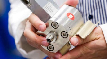 Scientist holding car battery