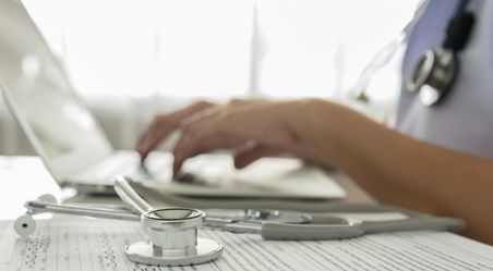 Doctor explaining to a patient using a tablet