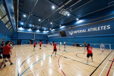 Students playing badminton in Ethos sports hall