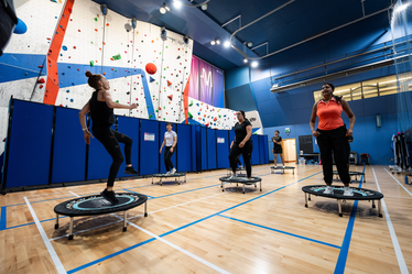 A group exercise class on trampoline