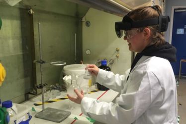 student in lab with VR headset on