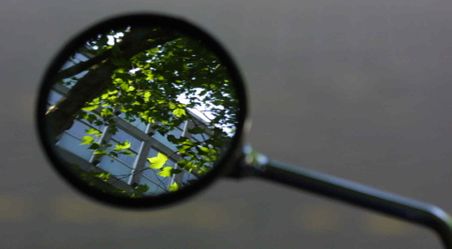 The reflection of the Sherfield building through a motorbike wing mirror