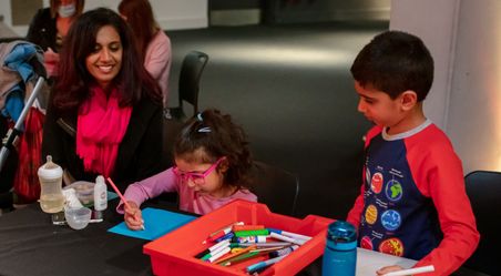 A young family draws their own image of the Sun