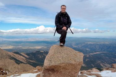 student standing on rock