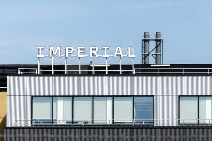 White city campus building with logo
