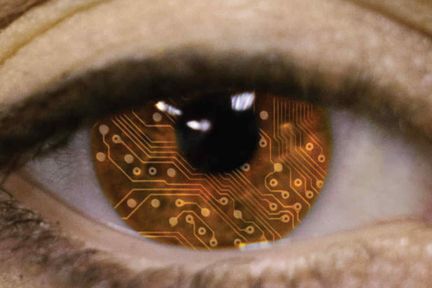 Close up of human eye where the brown iris is shown with a circuitboard pattern superimposed