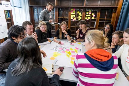 Students gathered in Dyson Building Library working on a project group discussion