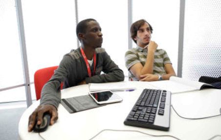 Students looking at computer screen