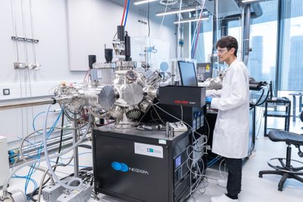 student wearing a lab coat in a lab