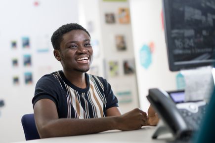 student seeking support at student hub