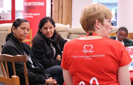 researcher talks to members of the public