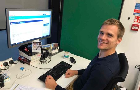 Oliver Schmidt sitting at his desk about to take part in the AMA