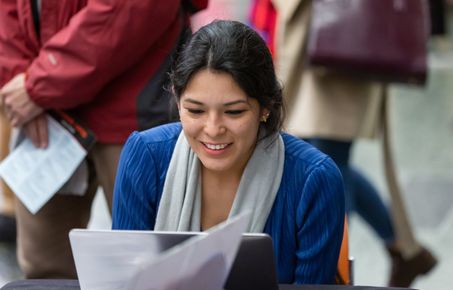 woman smiling at laptop