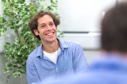 Dr Nir Grossman smiling for news photo
