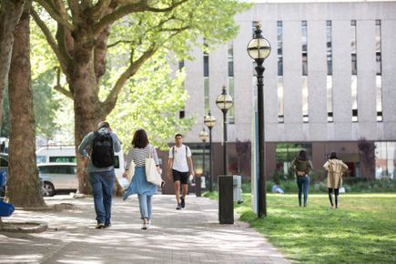 Students walking near the library.