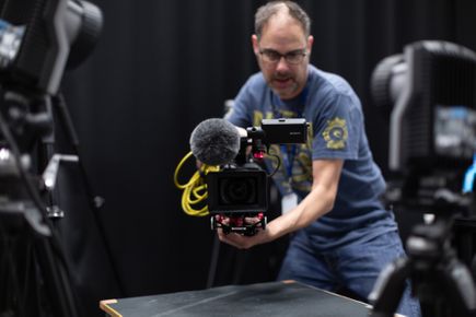 Digital Media Producer Martin Sayers operating a camera