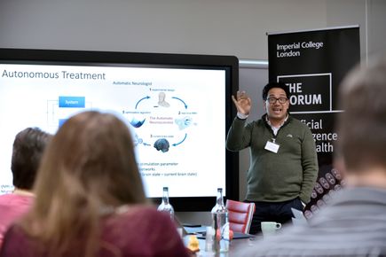 Photo of Professor Aldo Faisal giving a lecture