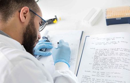 Image of researcher making notes