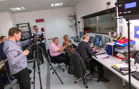 A TV crew filming some researchers