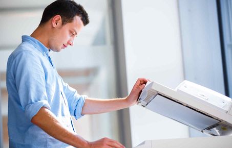 Man using a photocopier