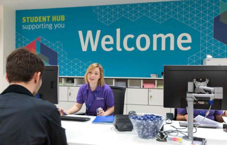 image of student hub reception with staff