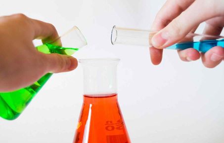 Mixing chemicals in a bottle 