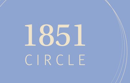 Graphic with 1851 Circle written in cream on a pale blue background