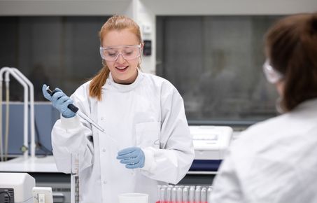 Student in the lab wearing goggles.