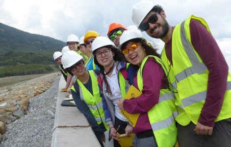 Msc.students happy to encounter a dam