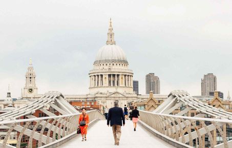 Tourist walking over London Bridge