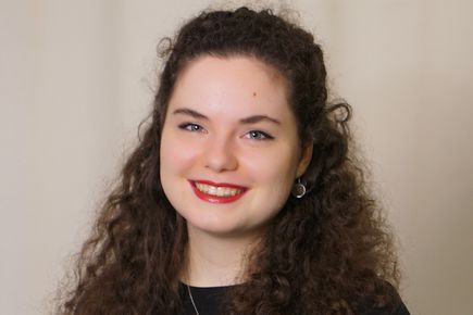 Headshot of PhD student, Celine, smiling and looking at the camera