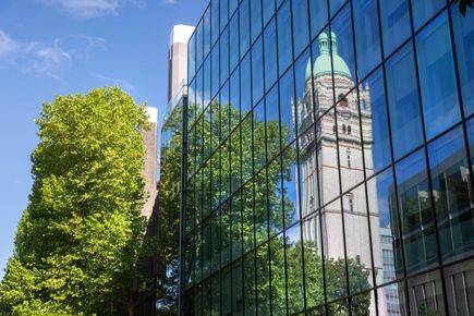 Queens tower reflection on Blue cube