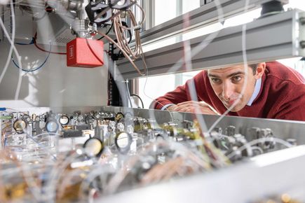 Scientist looking at quantum accelerometer