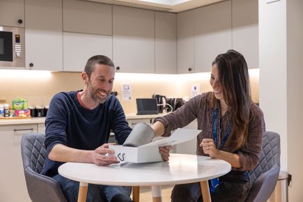 Two colleagues talking over a table