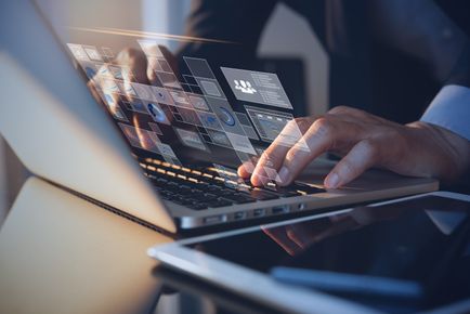 Man typing on laptop