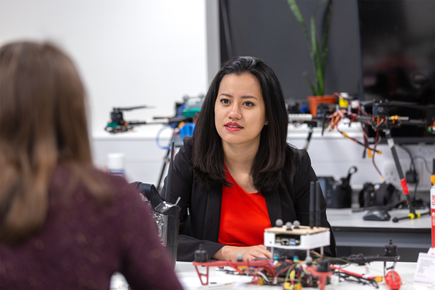 Female student interacting with female academic