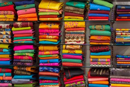 Shelves of brightly coloured clothing