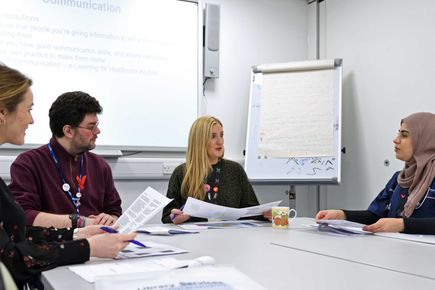 Librarian and users in training session