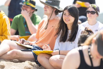 students sit down during a field trip