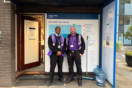 two community safety and support officers outside carpark gatehouse