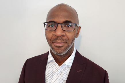 Portrait of Joel Assaoure, one of the Entrepreneurs' Pledgers, against a white background