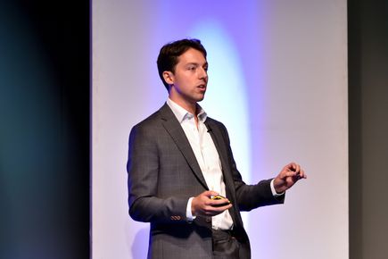 Entrepreneurs' Pledger Maxwell Munford gives a presentation in front of a screen