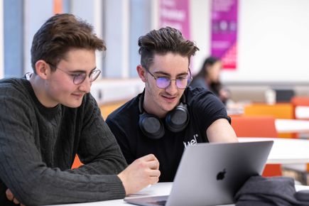 Students in GoStudy using a laptop