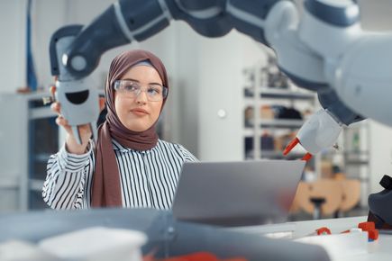 Image of a researcher working at a computer in a lab