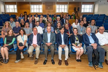 The symposium attendees pose for a photograph