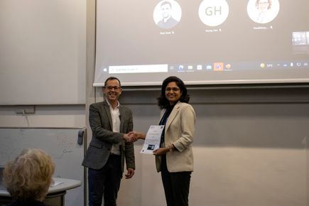 Gunjan Tyagi winning Best Oral Presentation at the Departmental Postdoctoral Symposium